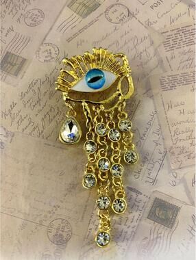 Eye-Catching Gold Tone Rhinestone Eye Brooch with Dangling Chains